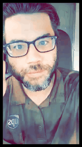 Man Wearing Glasses and 2Q Shirt