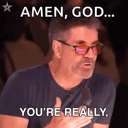 Man Wearing Glasses and Black Shirt Saying Amen