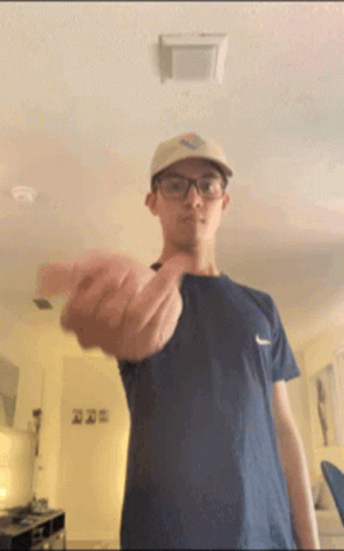 Man Wearing Glasses and Hat Flipping Off