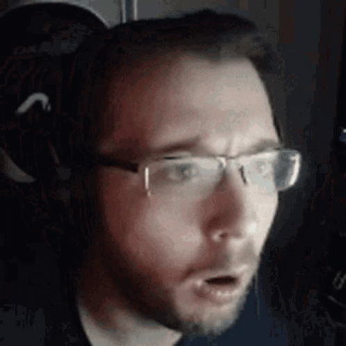 Man Wearing Glasses and Headphones
