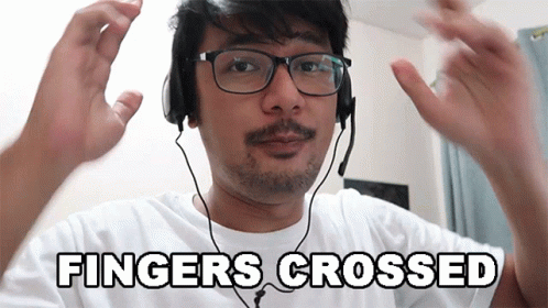 Man Wearing Glasses And Headphones Fingers Crossed GIF