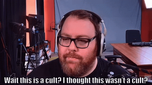 Man Wearing Glasses and Headphones Says Cult
