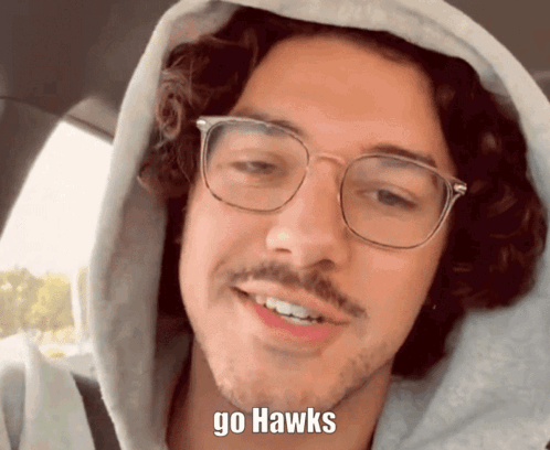 Man Wearing Glasses and Hoodie with Go Hawks