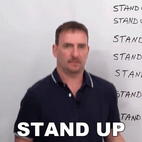 Man Wearing Glasses and LC Sign Shirt