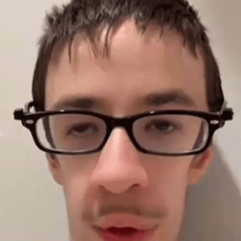 Man Wearing Glasses and Mustache Looking at Camera