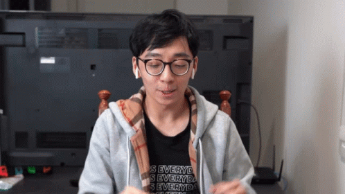 Man Wearing Glasses and S Everyd Shirt