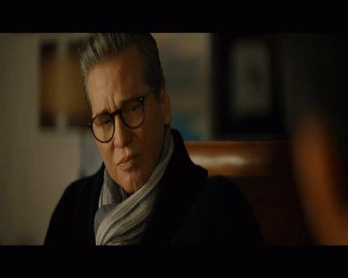 Man Wearing Glasses and Scarf Looking