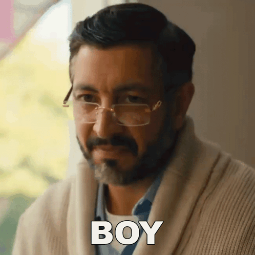 Man Wearing Glasses and Sweater Says Boy