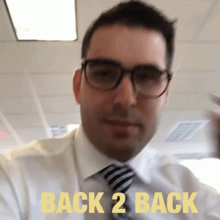 Man Wearing Glasses and Tie Says Back 2 Back