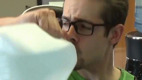 Man Wearing Glasses Drinking Water From Bottle