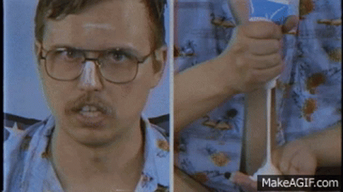 Man Wearing Glasses Holding Toothpaste
