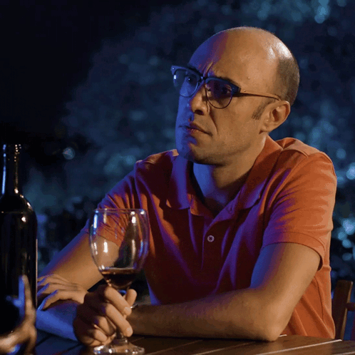 Man Wearing Glasses Holding Wine