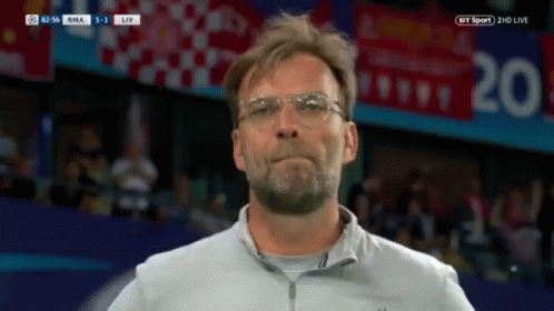 Man Wearing Glasses in Front of BT Sport Screen