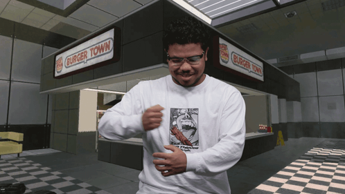 Man Wearing Glasses in Front of Burger Town