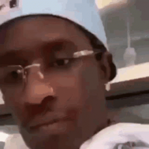 Man Wearing Glasses Looking At Camera GIF