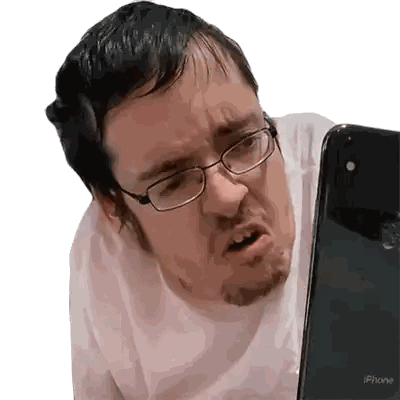 Man Wearing Glasses Looking at iPhone