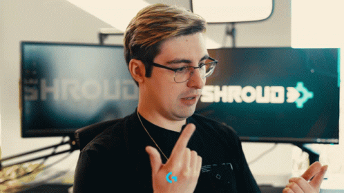Man Wearing Glasses Pointing At Shroud Sign GIF