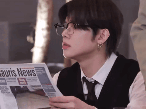 Man Wearing Glasses Reading Auris News