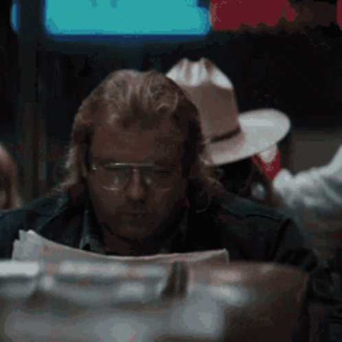 Man Wearing Glasses Reading Newspaper