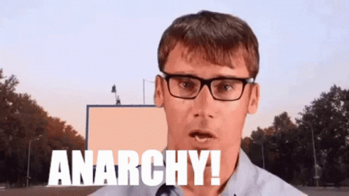 Man Wearing Glasses Saying Anarchy