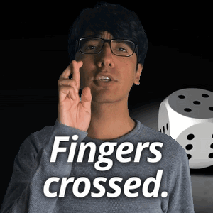 Man Wearing Glasses Saying Fingers Crossed Next to Dice