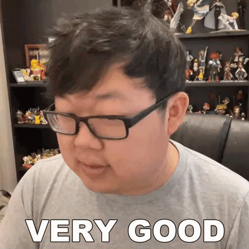 Man Wearing Glasses Saying Very Good GIF