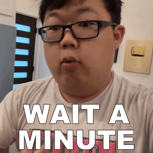 Man Wearing Glasses Says Wait a Minute