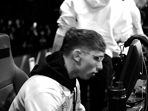 Man Wearing Glasses Sitting at Monitor