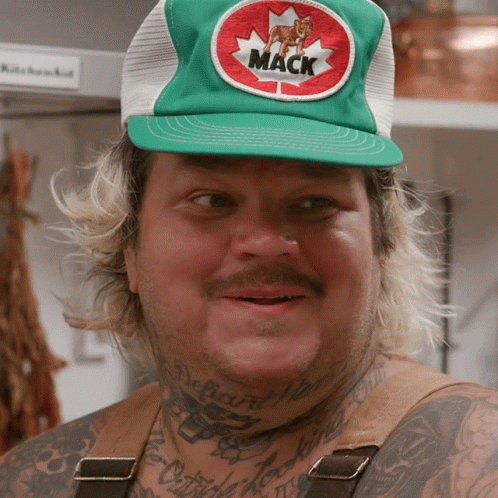 Man Wearing Green Mack and Hat