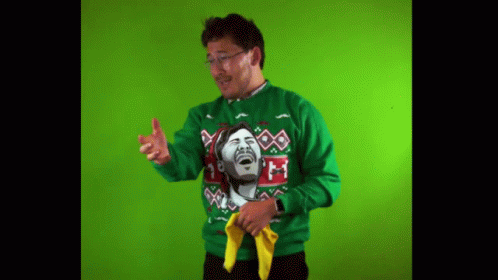 Man Wearing Green Sweater with Laughing Face