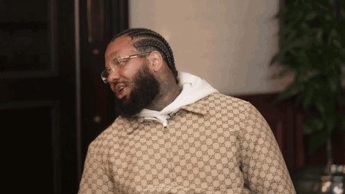 Man Wearing Gucci Jacket and Glasses