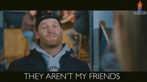 Man Wearing Hat and Hoodie Saying They Aren't My Friends