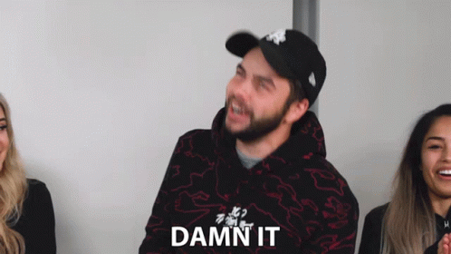 Man Wearing Hat and Hoodie Says Damn It