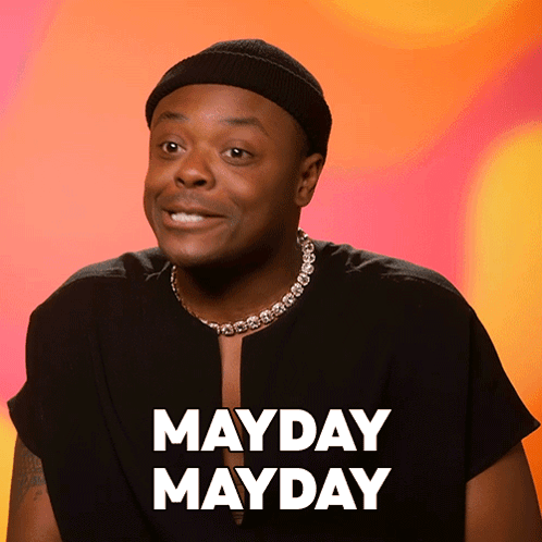 Man Wearing Hat And Mayday Mayday Necklace GIF