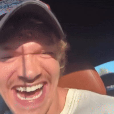 Man Wearing Hat and White Shirt Smiling