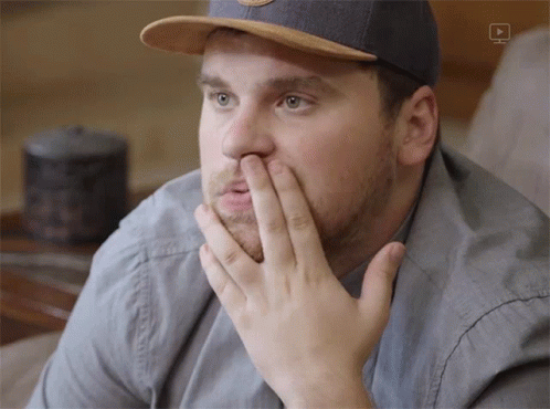 Man Wearing Hat Covering Mouth GIF