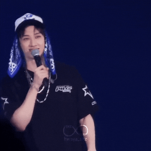 Man Wearing Hat Holding Microphone GIF