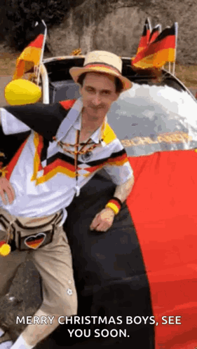 Man Wearing Hat in Front of Car With German Flags