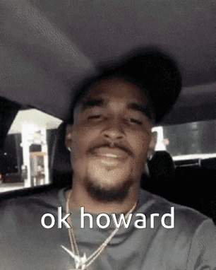Man Wearing Hat Necklace in Car Ok Howard