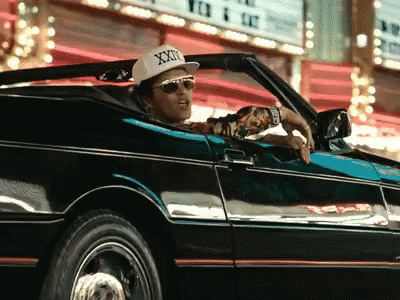 Man Wearing Hat Saying XXX Driving Car