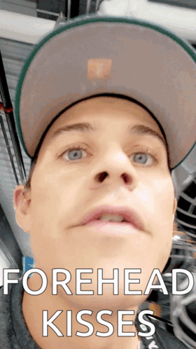 Man Wearing Hat With Forehead Kisses