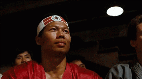 Man Wearing Headband With Chinese Symbol