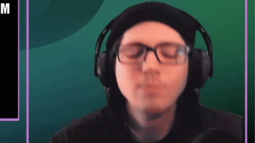 Man Wearing Headphones and Beanie