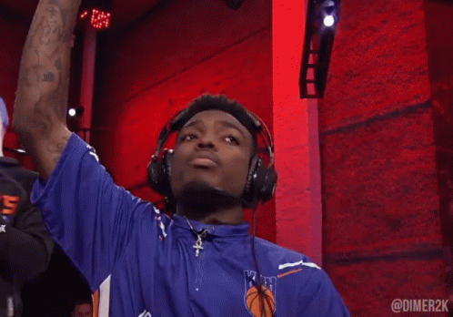 Man Wearing Headphones and Blue Shirt with Ruth