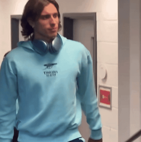 Man Wearing Headphones And Emirates Sweatshirt GIF
