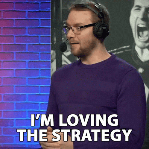 Man Wearing Headphones and Glasses Says I'm Loving the Strategy