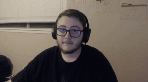 Man Wearing Headphones and Glasses