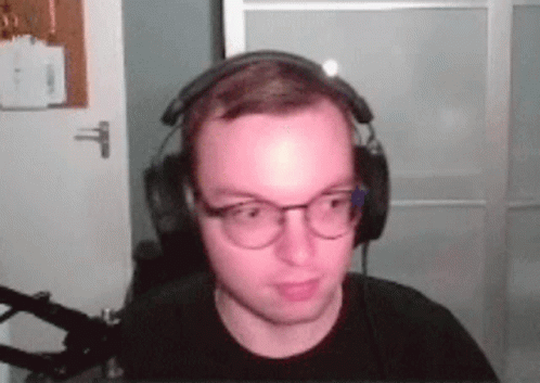 Man Wearing Headphones and Glasses