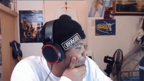 Man Wearing Headphones and Grav Beanie