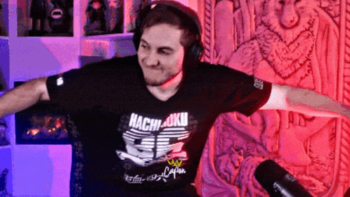 Man Wearing Headphones and Hachi-Okui Shirt